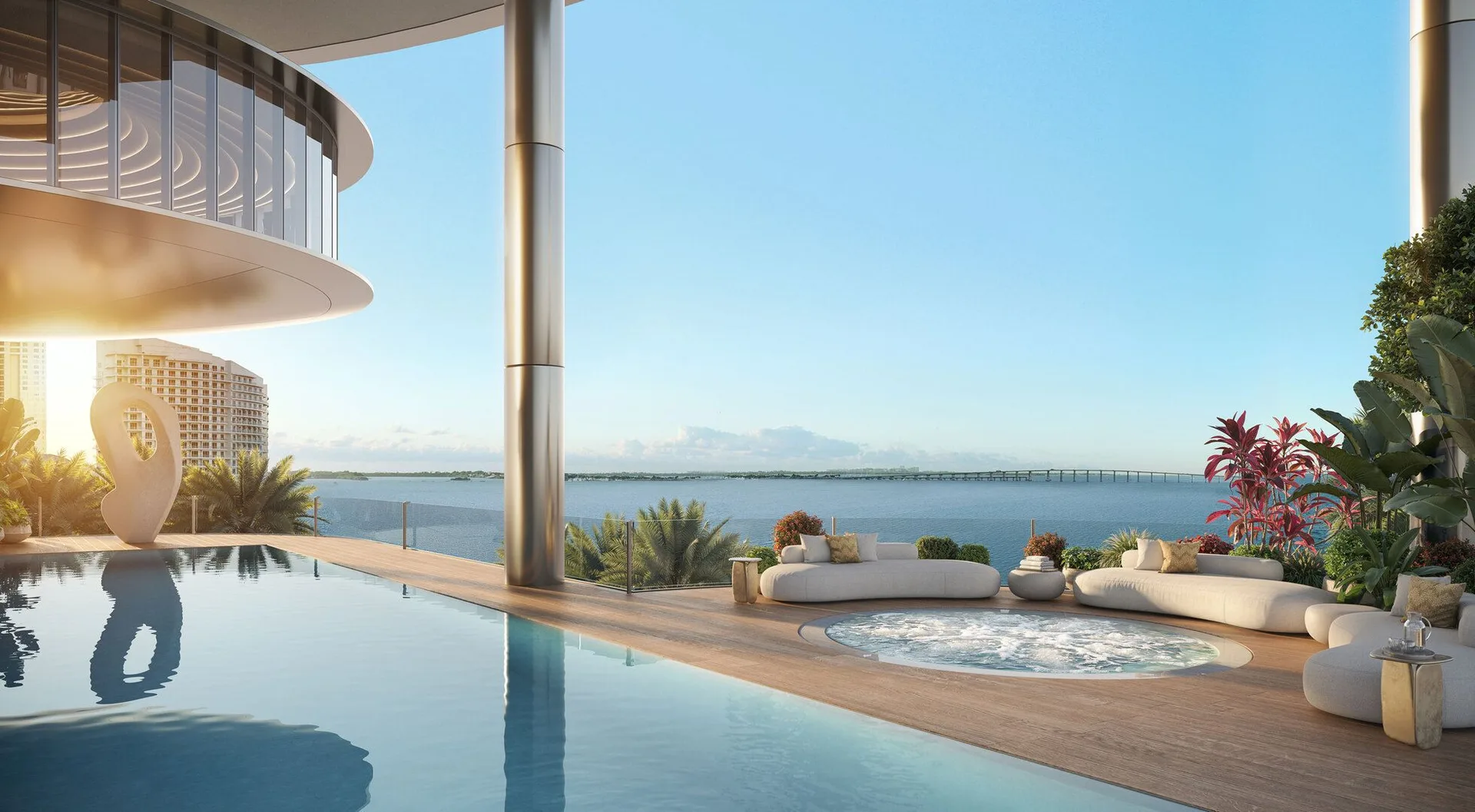 Piscina infinita con jacuzzi y deck de teca sobre la bahía